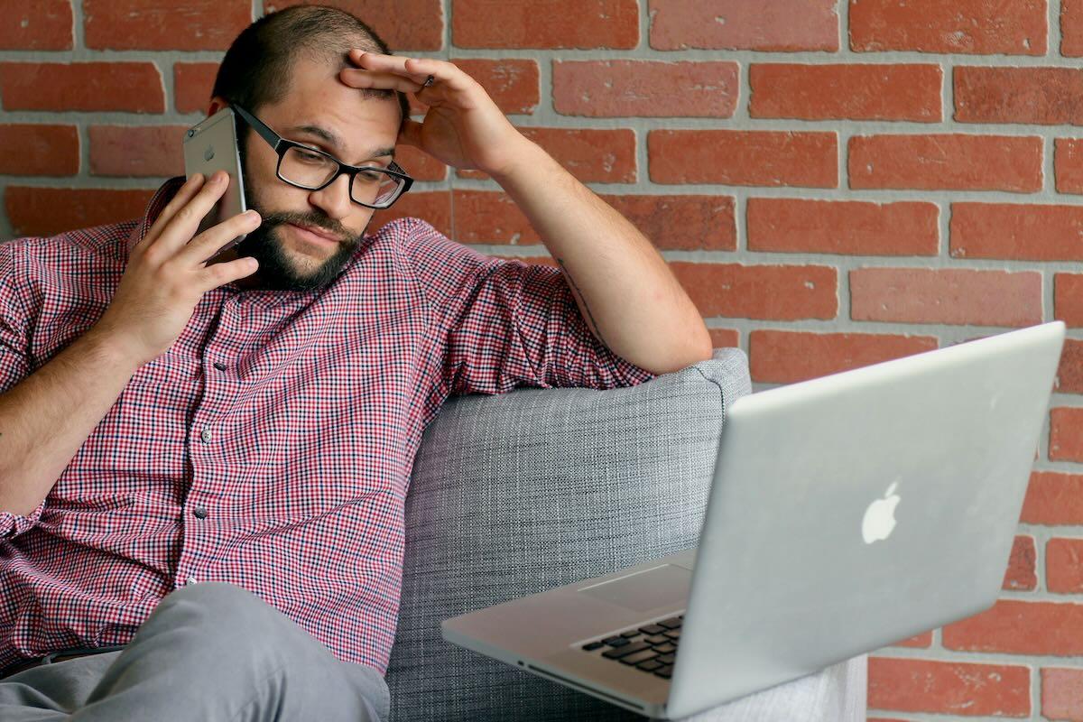 Frustrated man with laptop